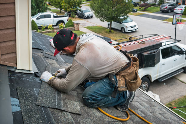 Professional Roofing technician working in Brainard, NY